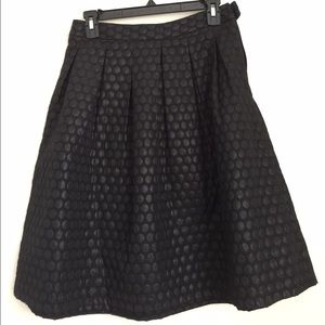 Polka dot black skirt.